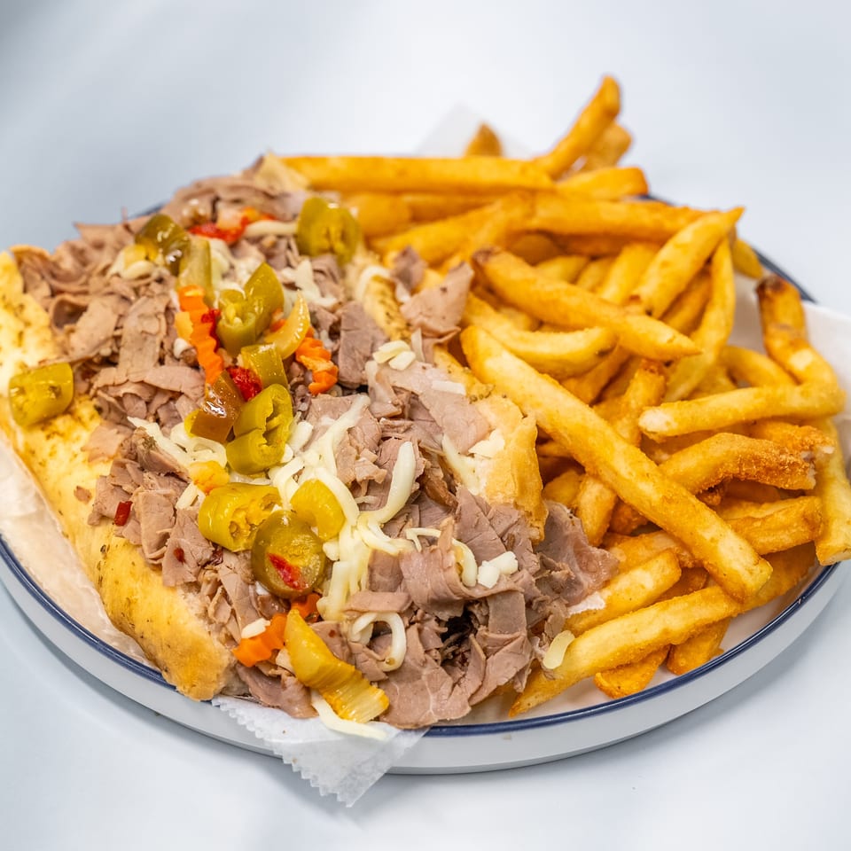 Sharks Fish & Chicken's Italian beef sandwich with giardiniera and a side of golden fries.